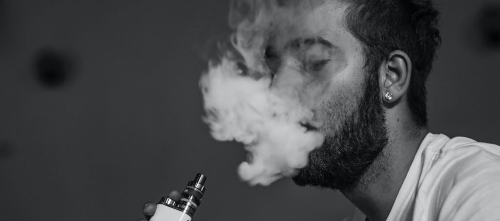 Man smoking and high in marijuana edibles