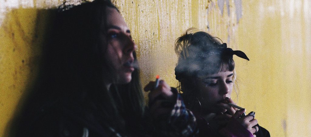 Two girl smoking together
