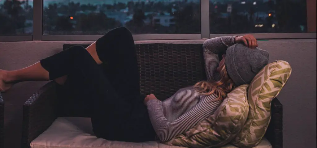 a girl lying on a chair to sober up