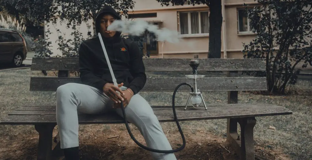 A man smoking on a hookah