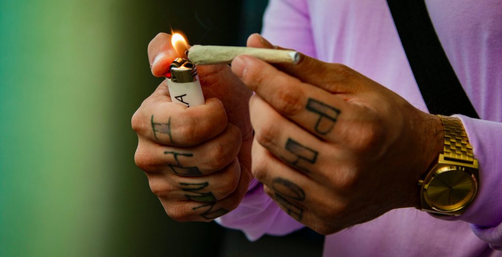 Lighting a joint of marijuana