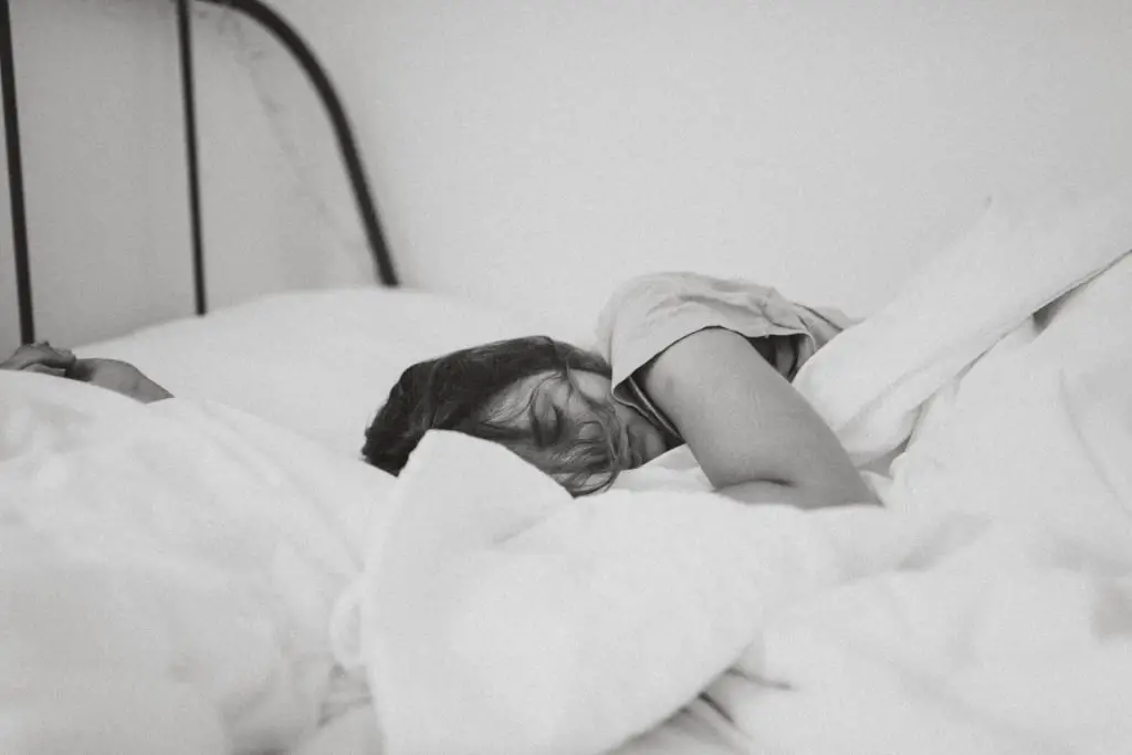 Sleeping women laying on the bed